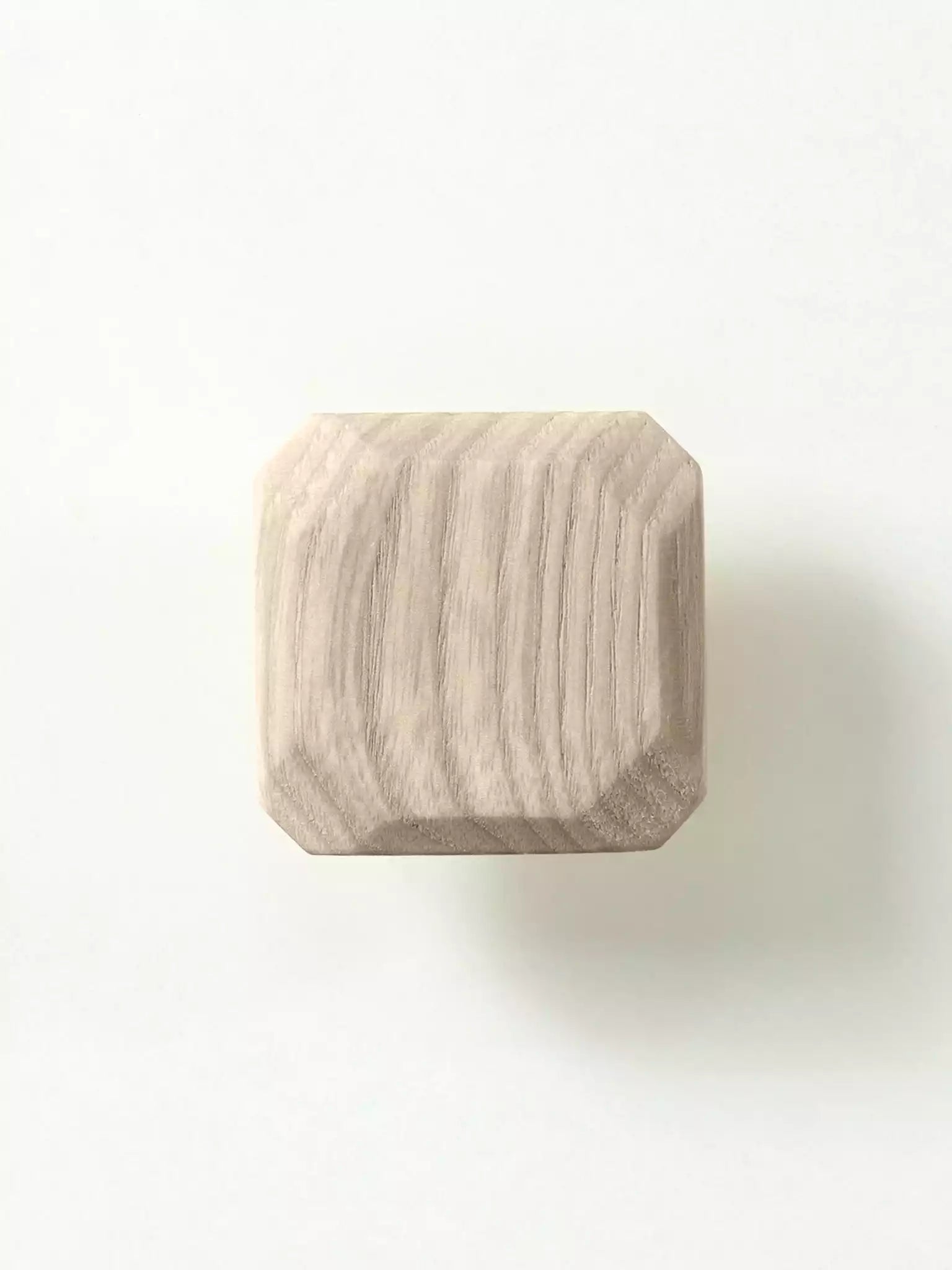 Wooden drawer pull handle photographed on white background