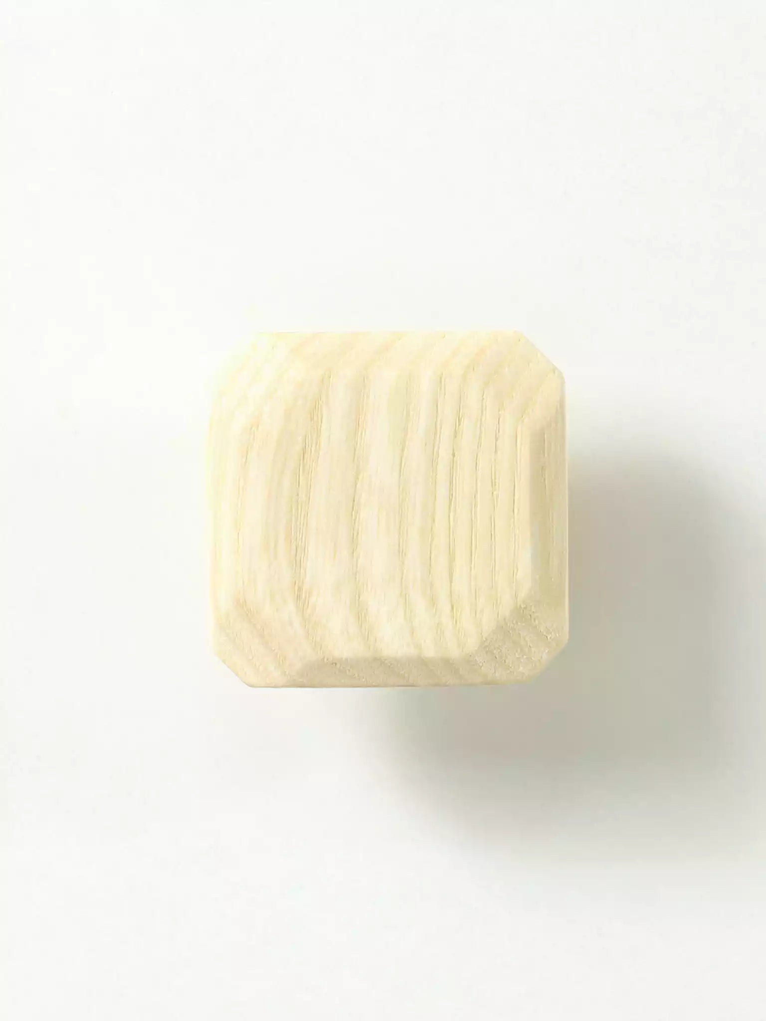 Wooden furniture pull handle with visible wood grain