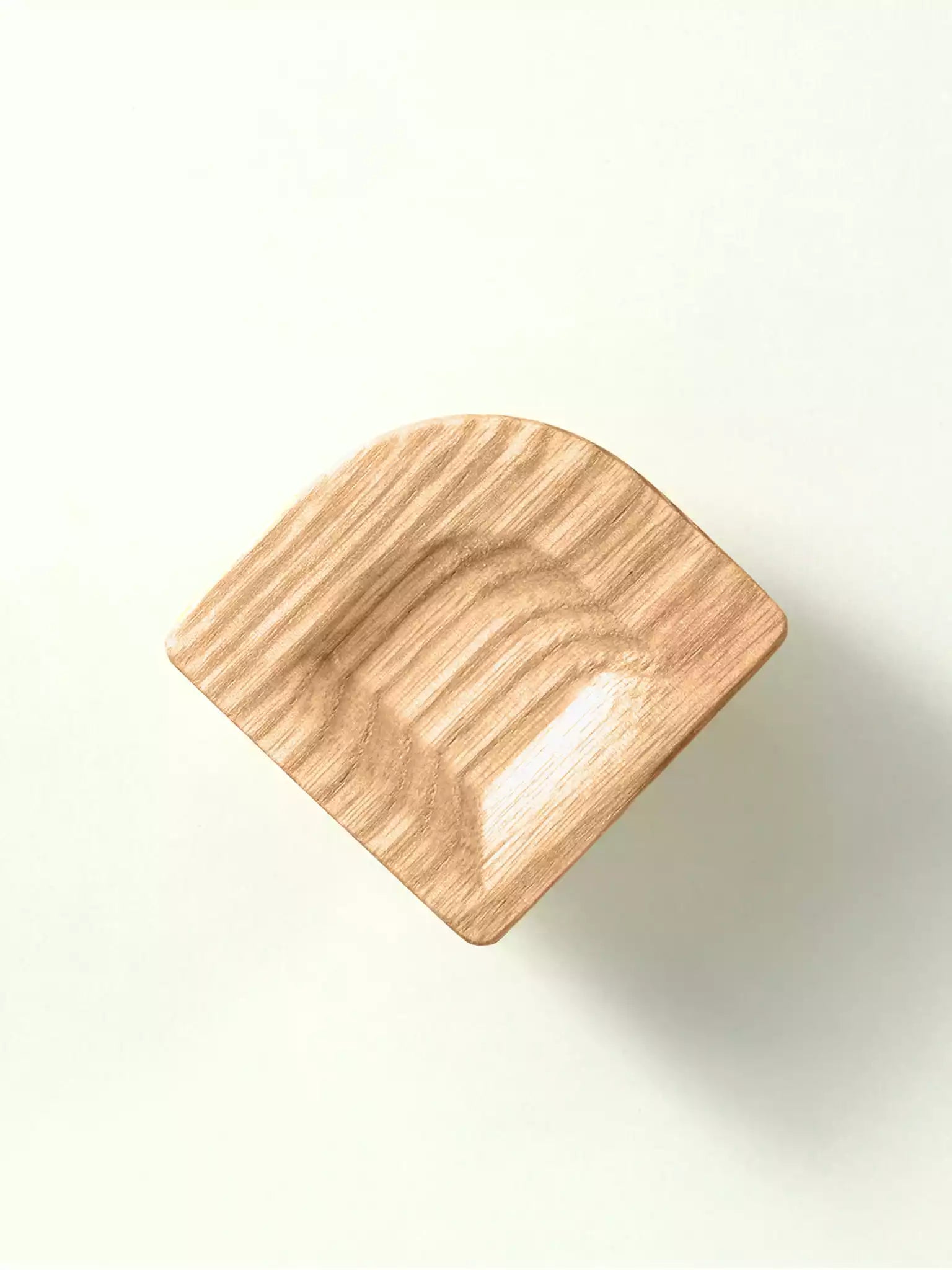 handcrafted solid wood pull on a white background