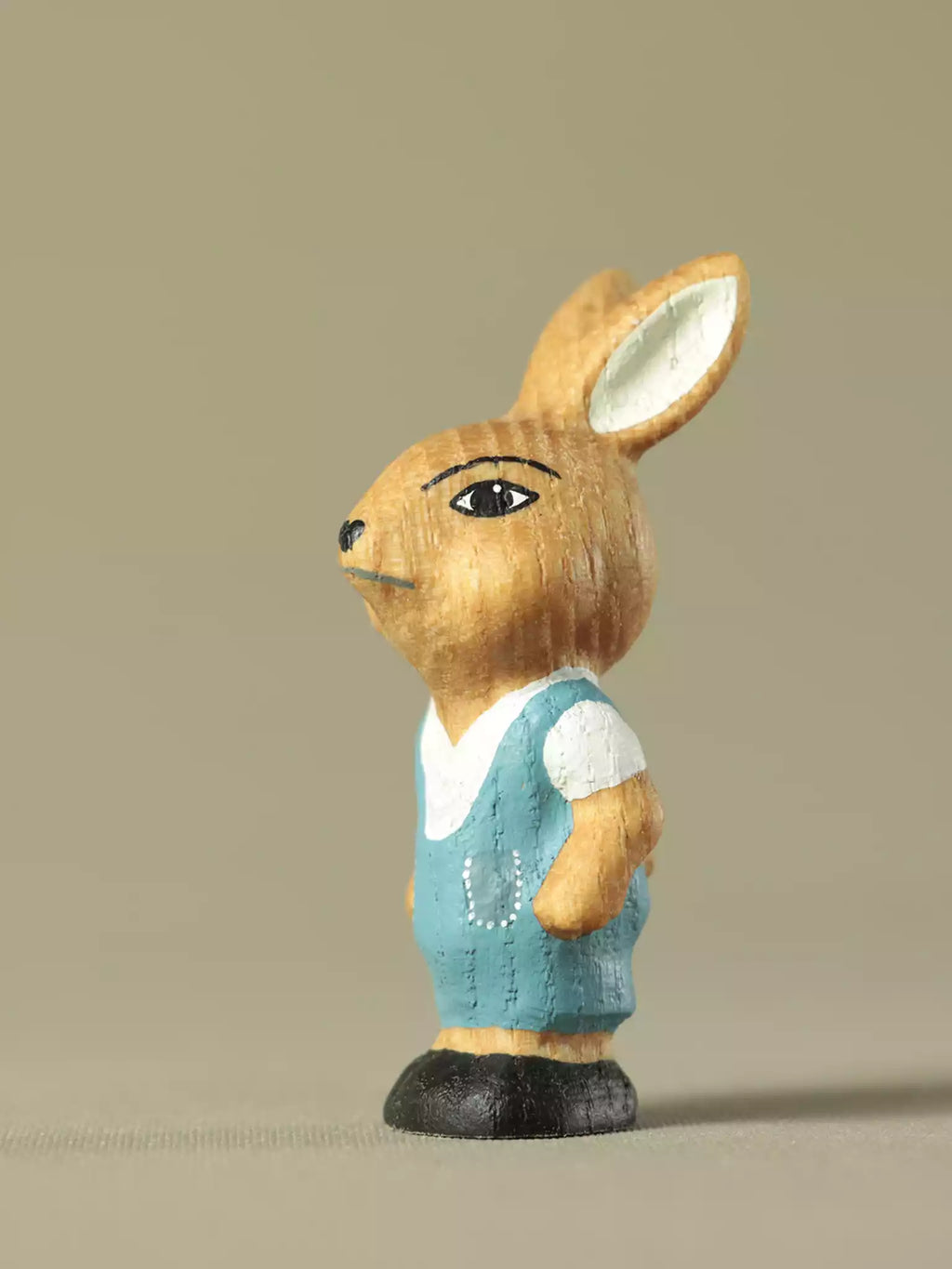 Wooden rabbit boy toy with blue overalls