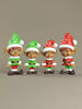 Four Christmas elves in festive outfits on a beige background