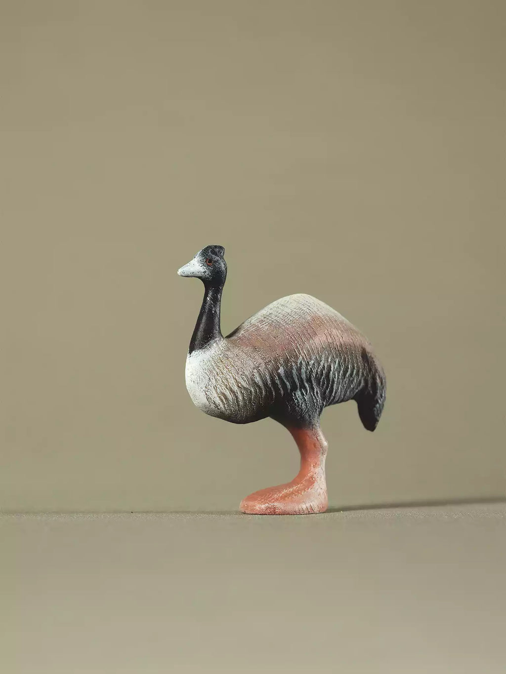 Hand-painted wooden emu toy with brown and black shading, eco-friendly Montessori and Waldorf-inspired animal figure.