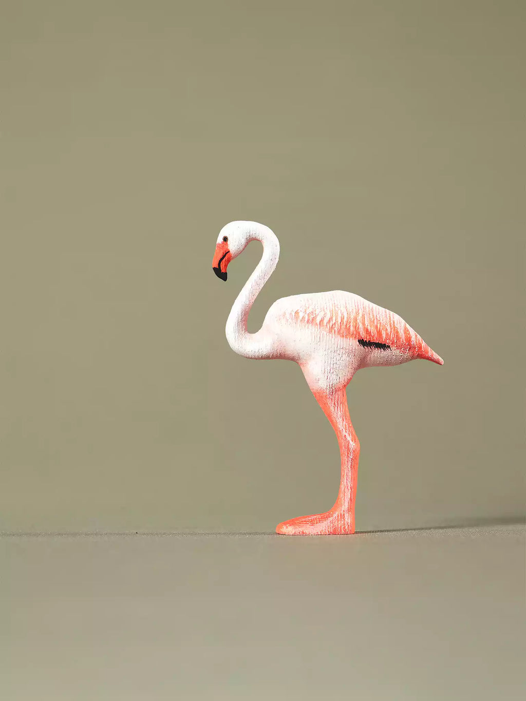 Side-view wooden flamingo toy with pink and white shading, eco-friendly Montessori learning toy.