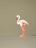 Hand-painted wooden flamingo figurine viewed in profile, sustainable eco-friendly toy for open-ended play.