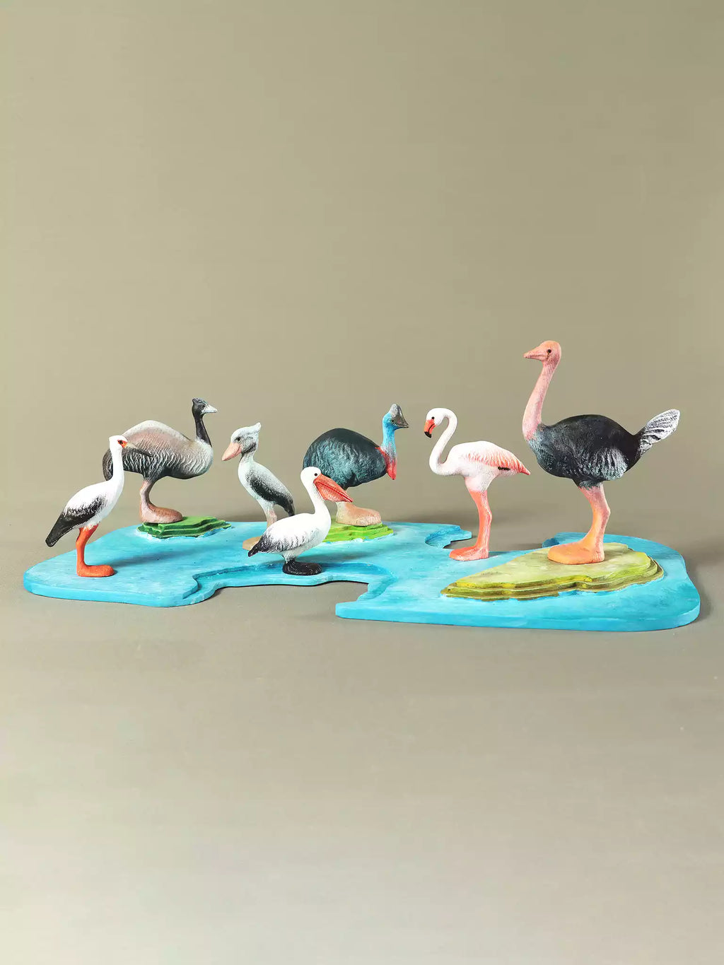 Collectible wooden bird set featuring pelican, stork, shoebill, cassowary, emu, flamingo, and ostrich.