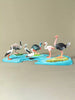Collectible wooden bird set featuring pelican, stork, shoebill, cassowary, emu, flamingo, and ostrich.