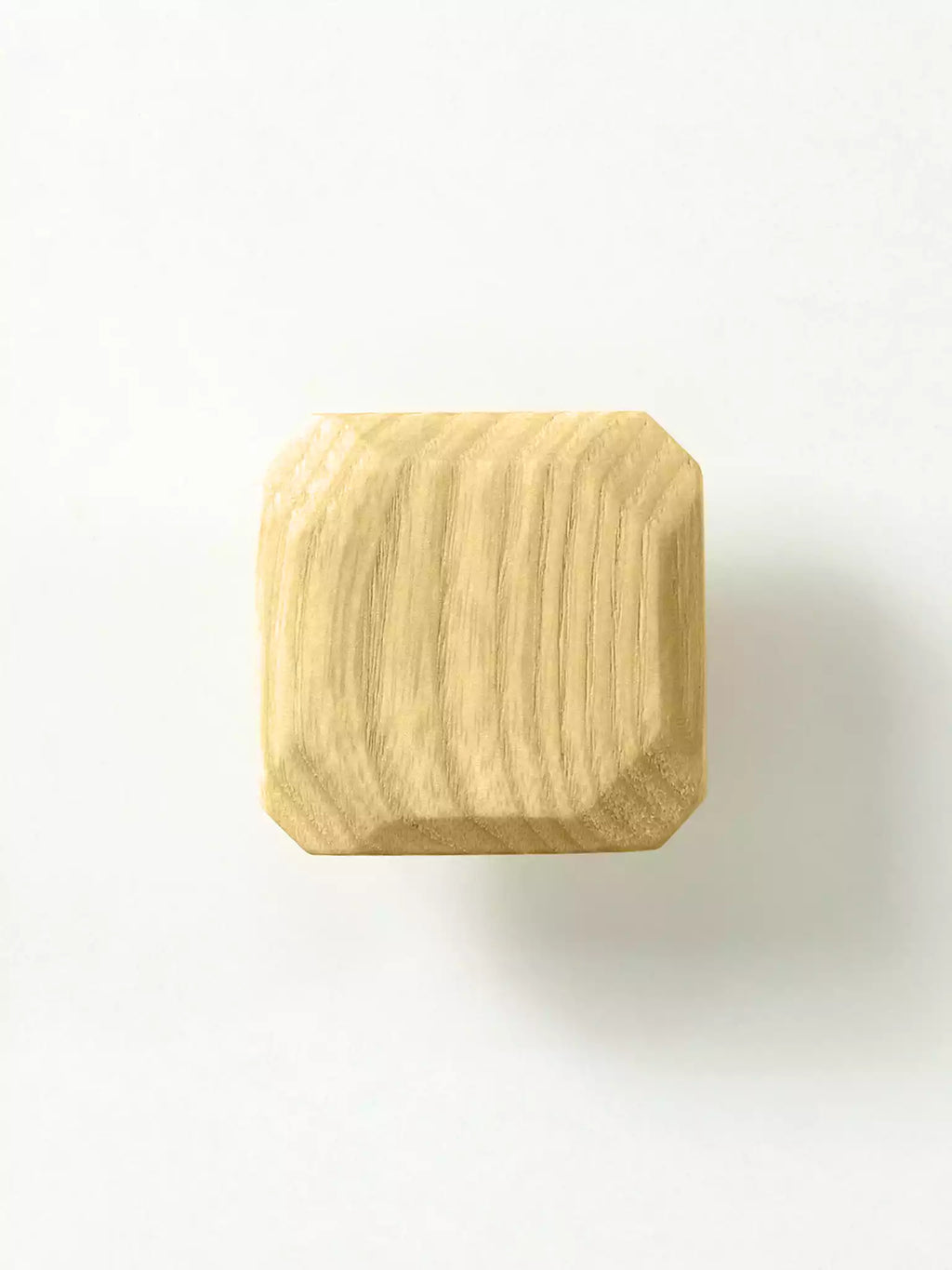 Natural wood cabinet pull with clean square shape

