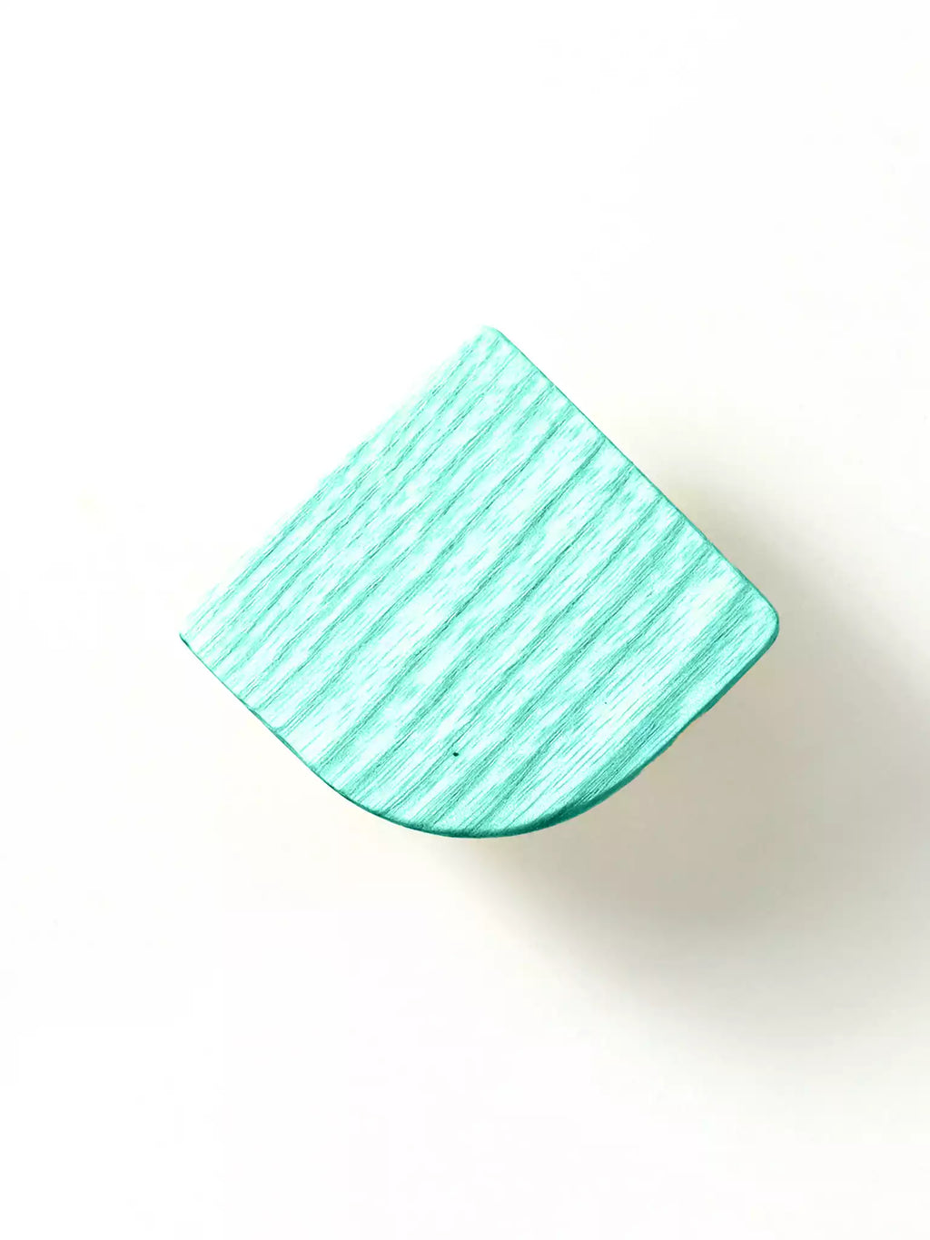 Light-toned wooden dresser knob with visible grain