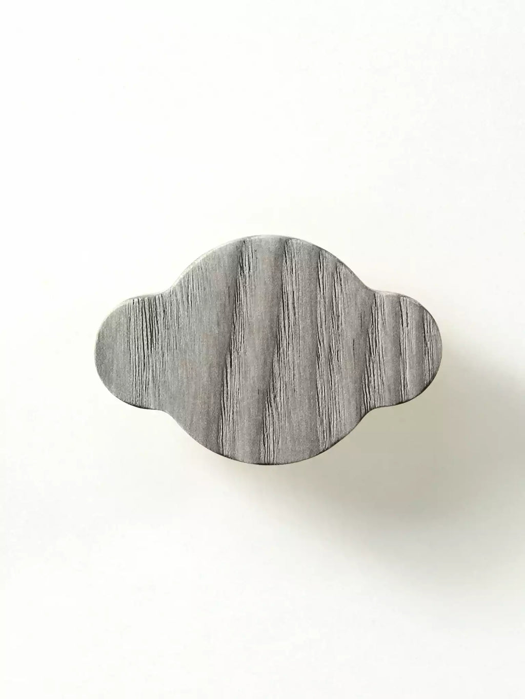 Minimal solid wood cabinet handle with visible grain

