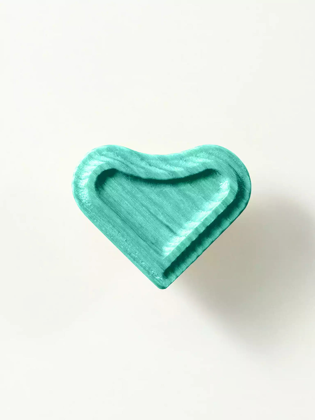 Heart-shaped wooden drawer knob with visible grain