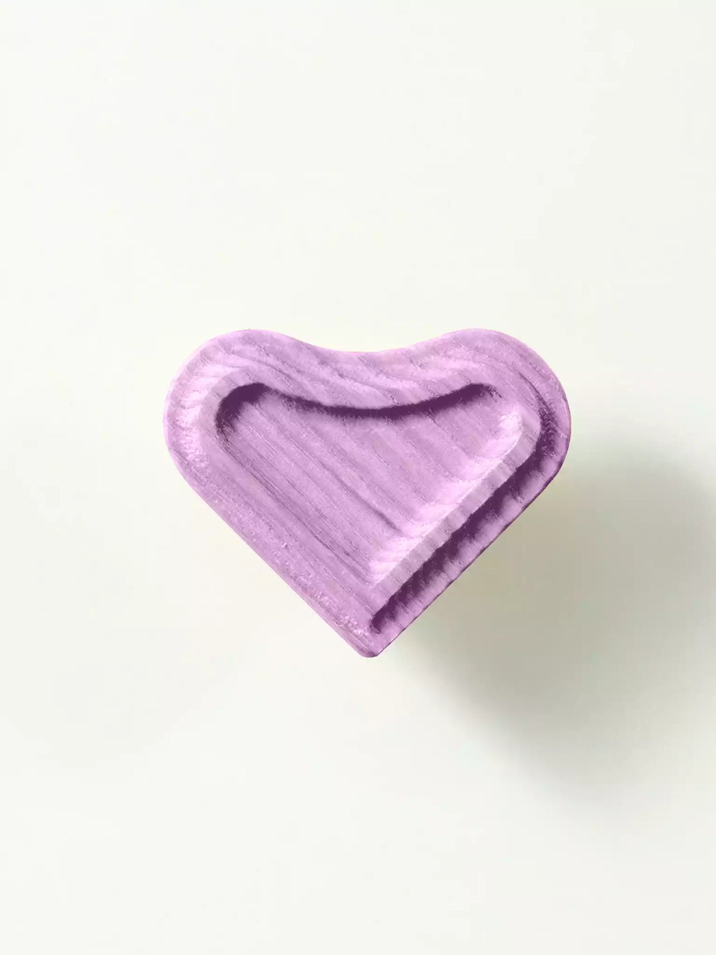 Carved wooden heart knob with smooth surface
