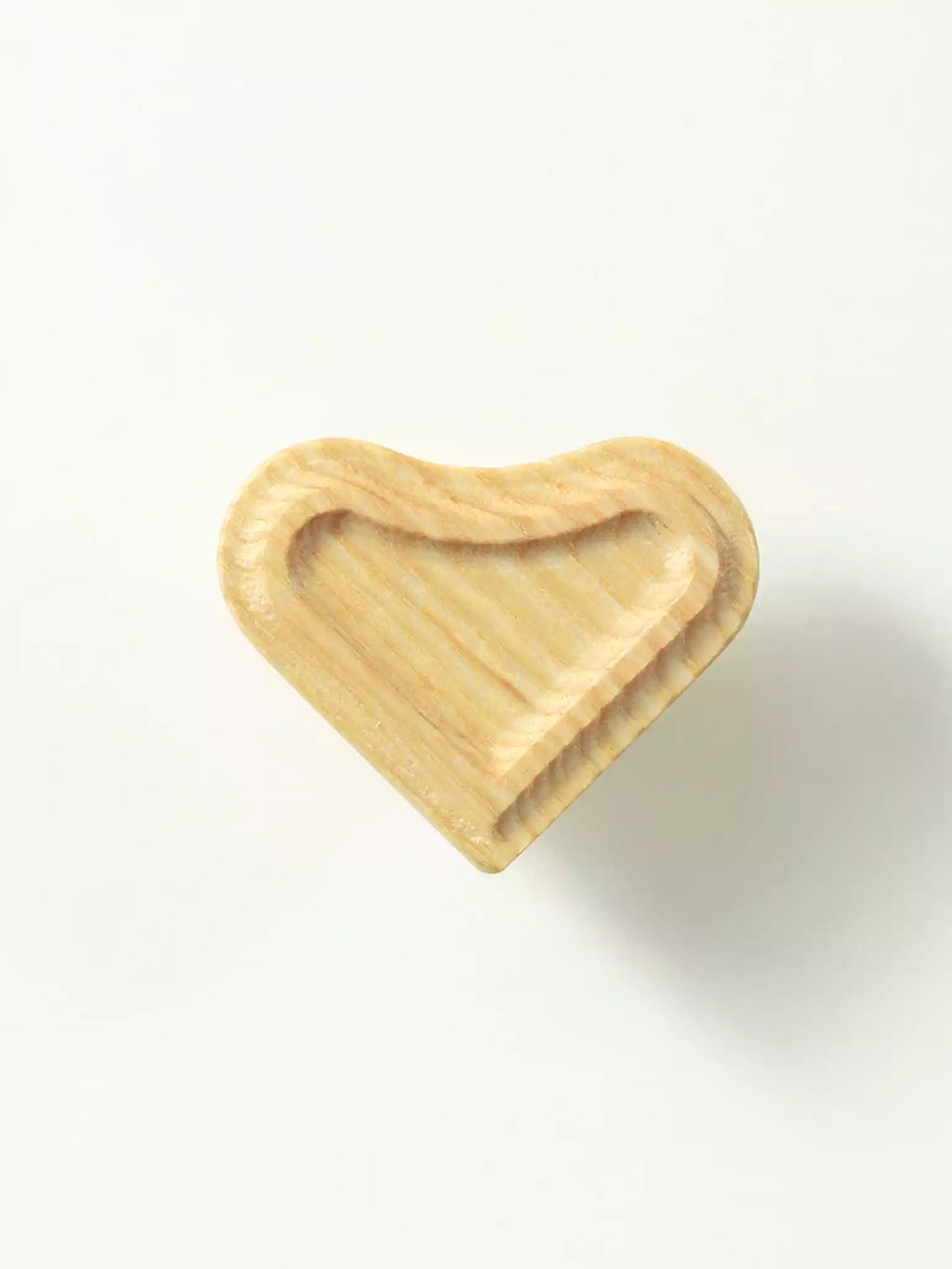 Heart-shaped wooden cabinet knob in natural wood

