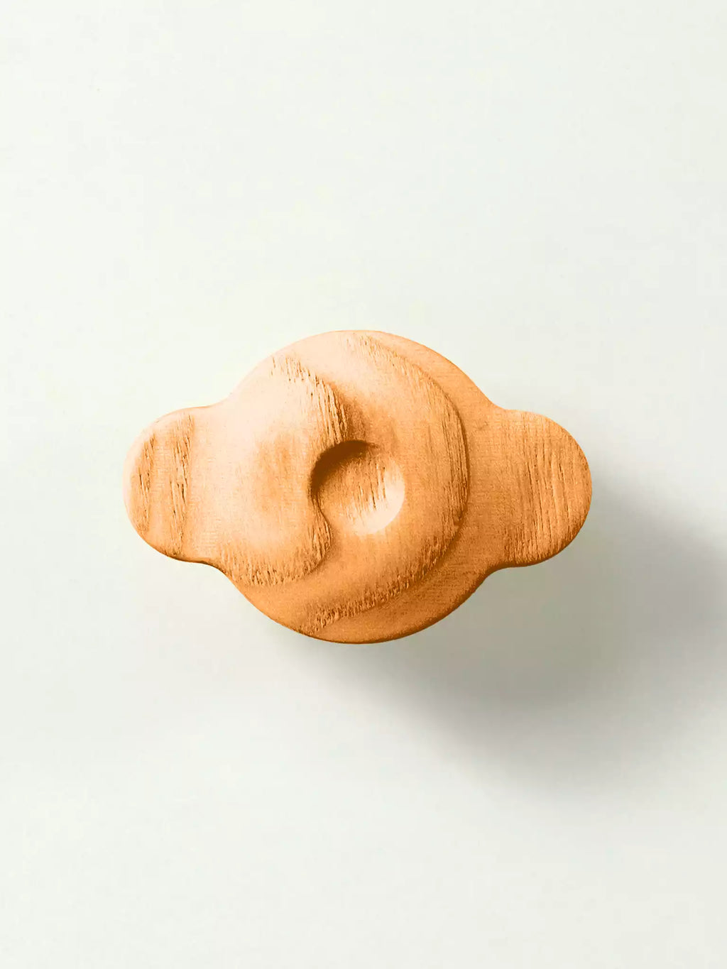 Minimalist wooden handle for drawers with visible grain