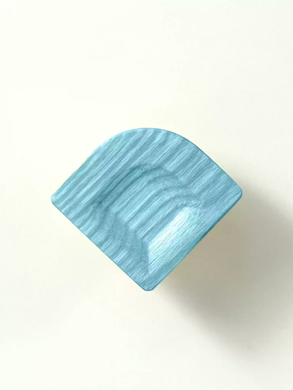 Blue rectangular knob on a white background