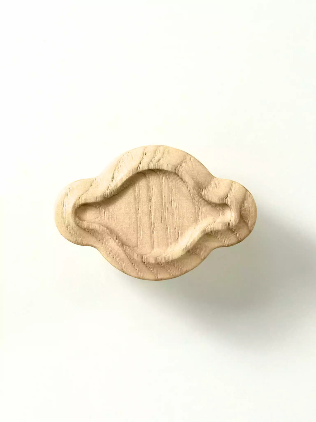 Wooden leaf-shaped pulls on a white background