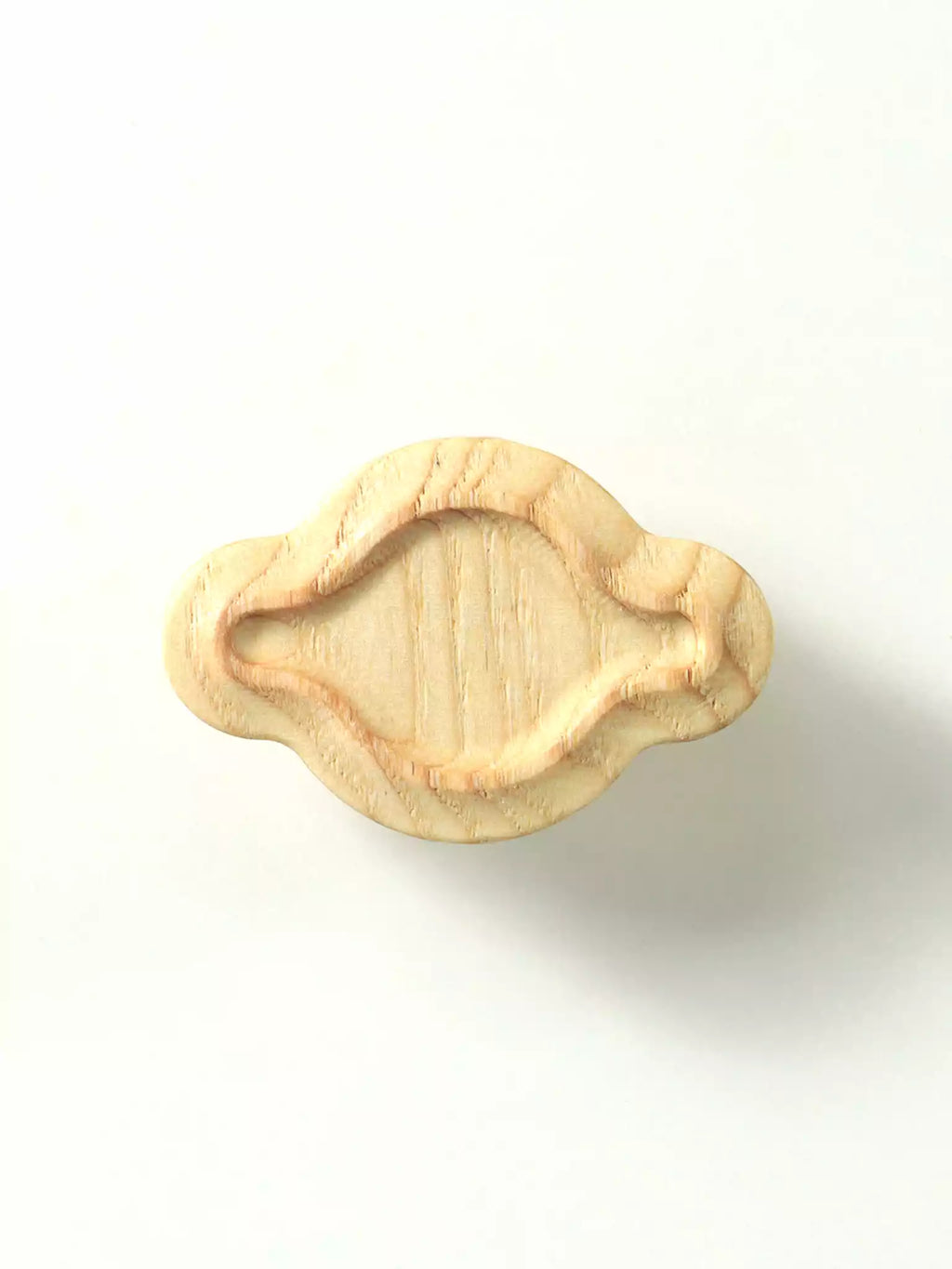 Wooden pull knob on a white background