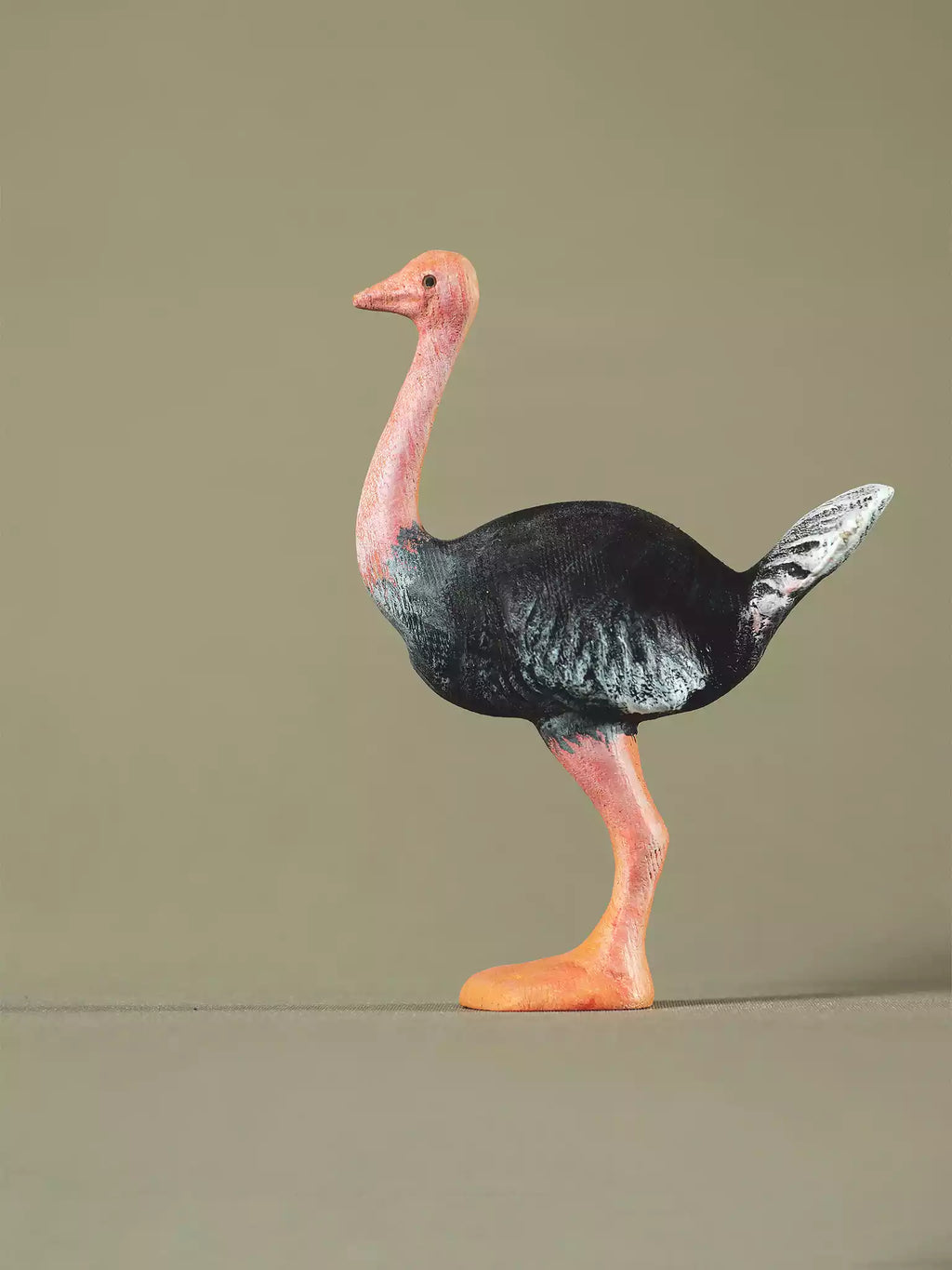 Montessori-style wooden ostrich figure designed for educational and imaginative activities.
