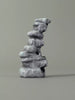 Gray stone sculpture on a gray background