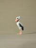 Hand-painted wooden shoebill bird toy on neutral background, eco-friendly Montessori and Waldorf-inspired figure.
