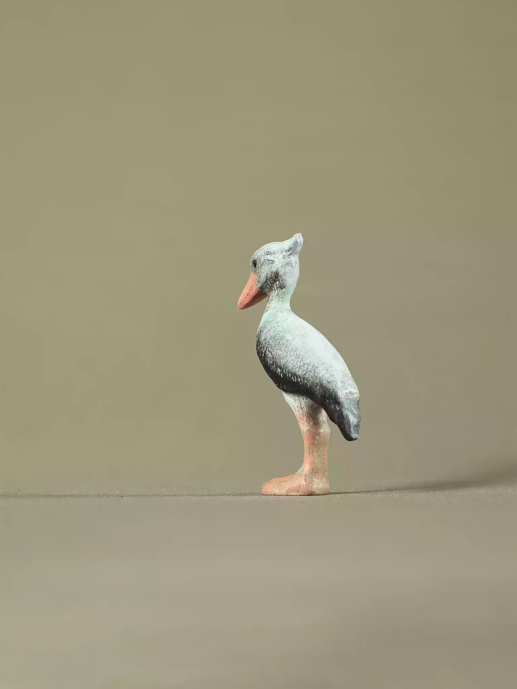 Non-toxic painted wooden shoebill bird figure for sustainable playrooms.