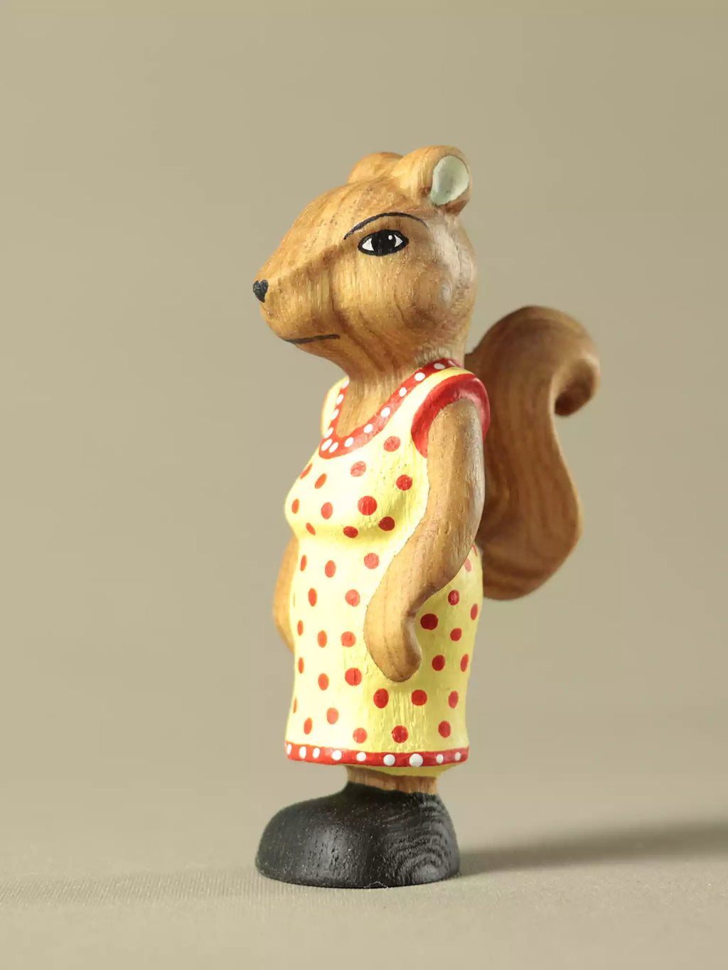 Handcrafted wooden squirrel with yellow polka dot dress