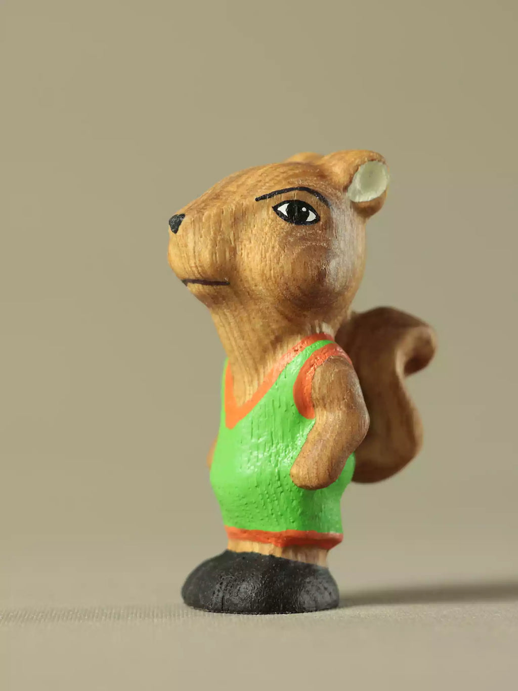 Baby squirrel wooden toy figure standing with curled tail